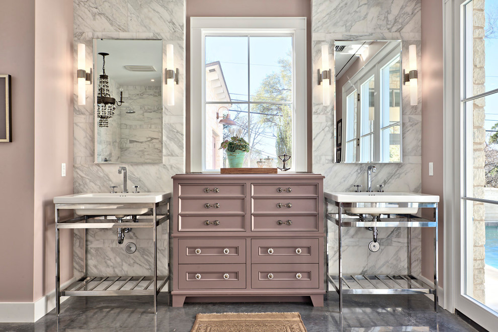 Large transitional master bathroom in Austin with a console sink, concrete floors, gray tile, white tile, marble, grey floor, a freestanding tub, an open shower, a two-piece toilet, pink walls, an open shower, white benchtops and recessed-panel cabinets.