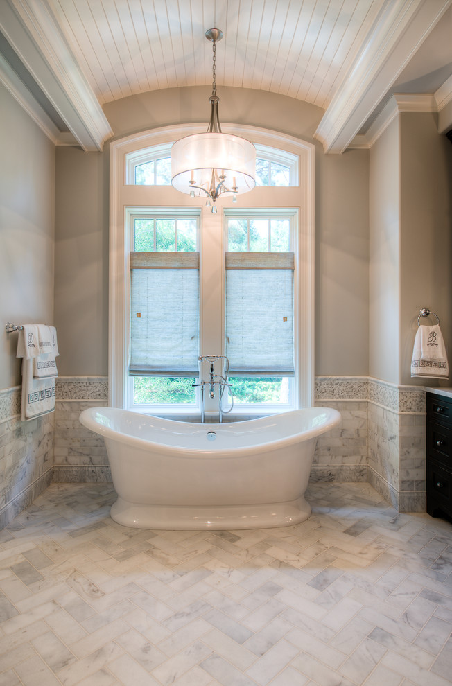 Inspiration for a traditional bathroom in Charleston with a freestanding tub.