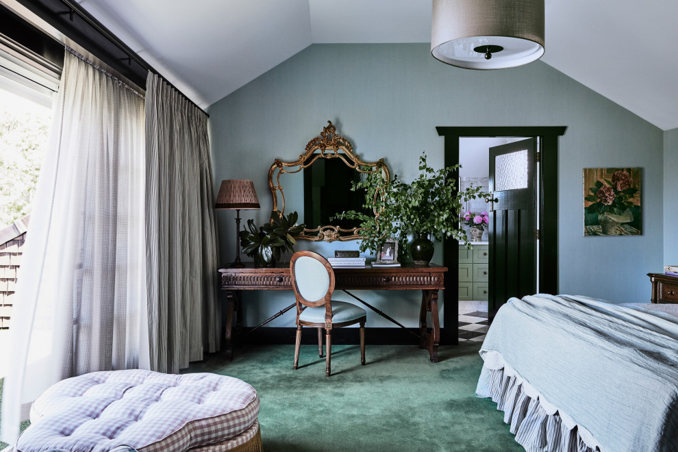 Large transitional master bedroom in Sydney with blue walls, carpet and green floor.