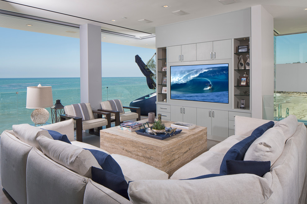 Beach style family room in Los Angeles with no fireplace and a built-in media wall.