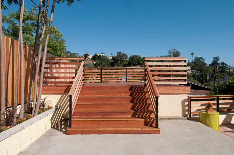 This is an example of a mid-sized mediterranean rooftop deck in Los Angeles with no cover.