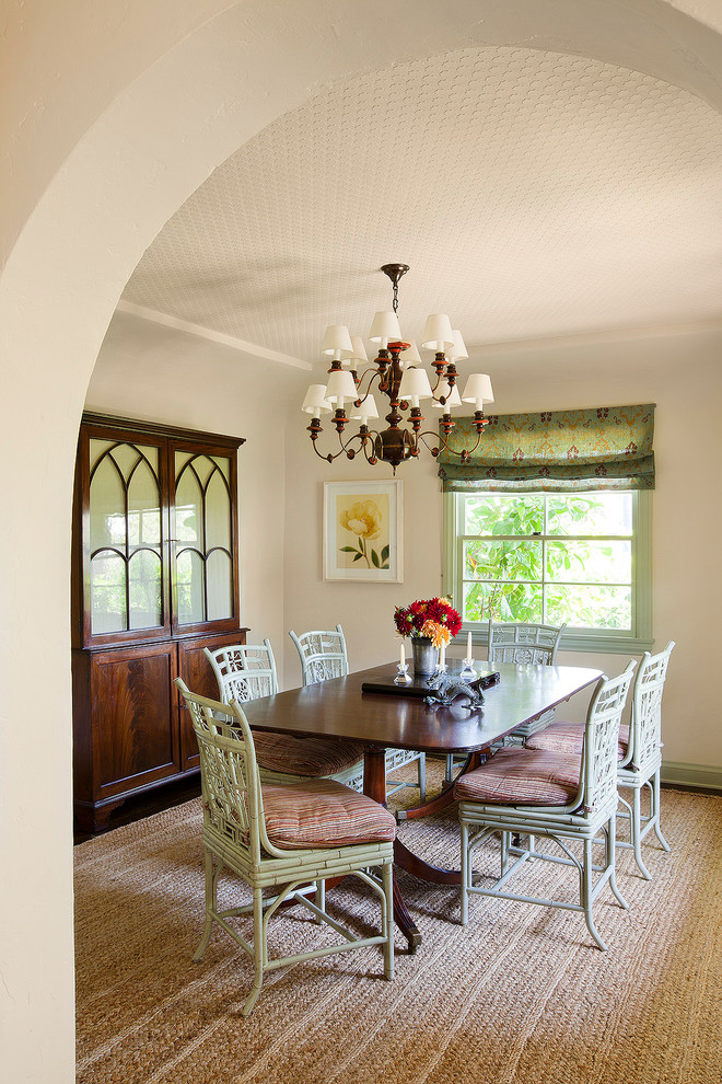 Design ideas for a large mediterranean separate dining room in Los Angeles with white walls and dark hardwood floors.