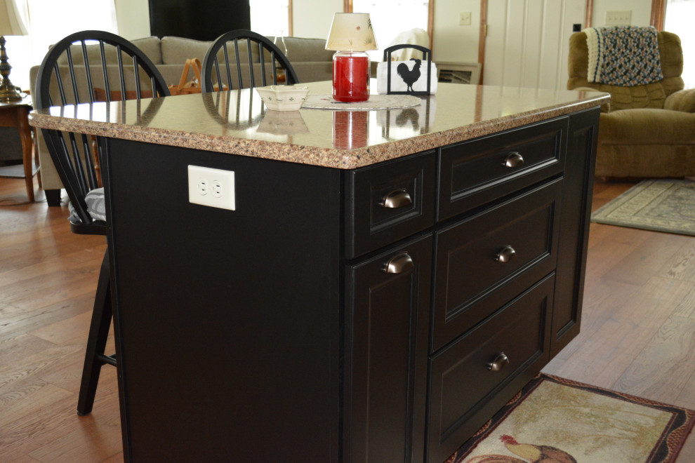 Small transitional l-shaped medium tone wood floor and brown floor eat-in kitchen photo with an undermount sink, flat-panel cabinets, beige cabinets, quartz countertops, stainless steel appliances, an island and brown countertops