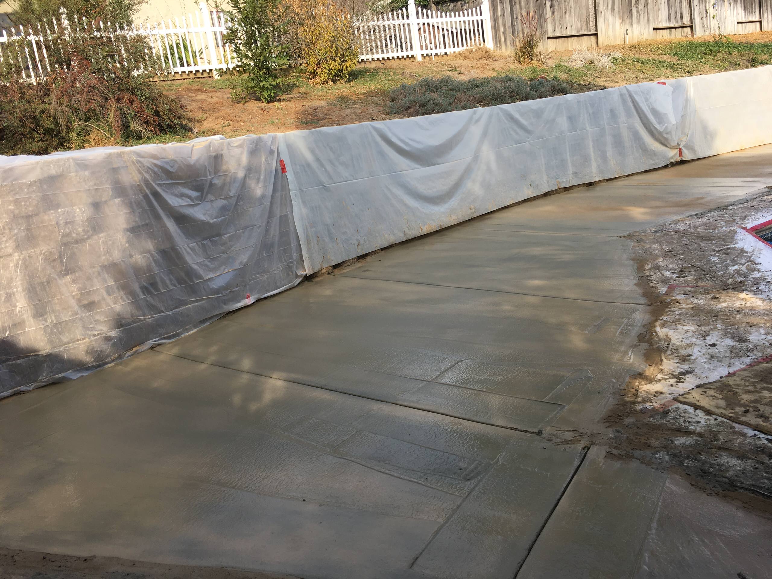 Protecting retaining wall from splattered concrete