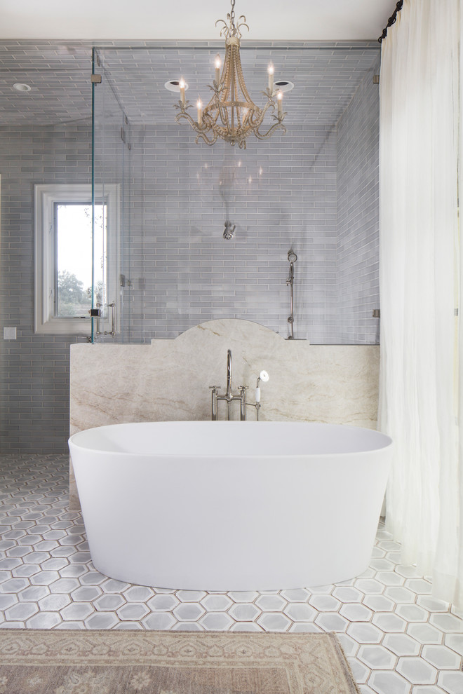 Inspiration for a large transitional kids bathroom in Austin with a freestanding tub, a corner shower, ceramic tile, grey walls, terra-cotta floors, grey floor and a hinged shower door.