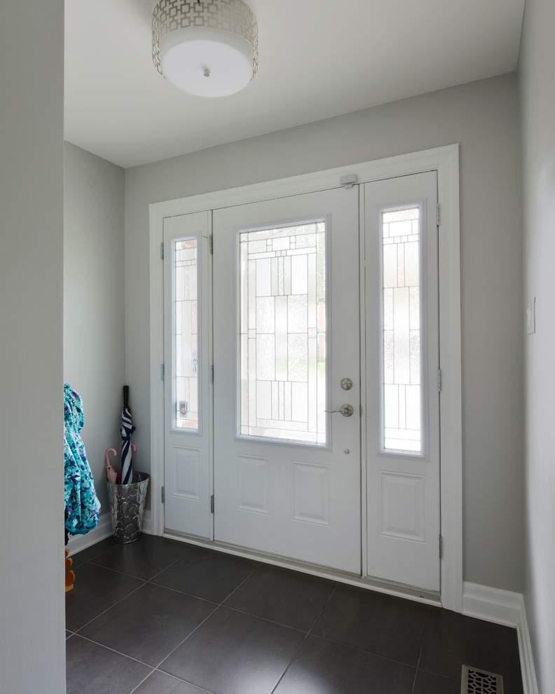 Small transitional ceramic tile front door photo in Ottawa with gray walls and a white front door