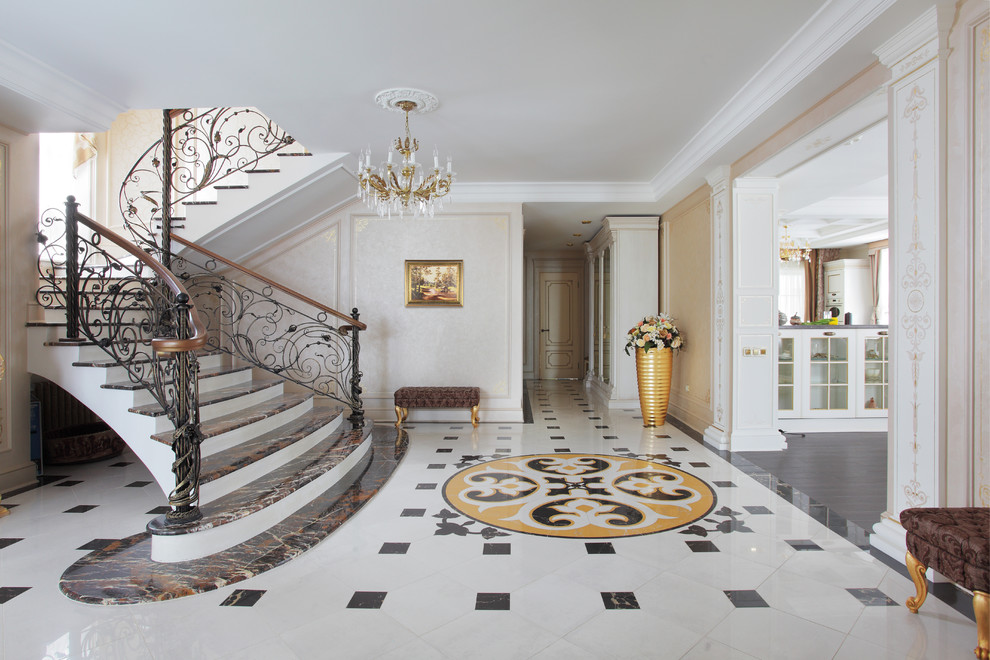 Traditional entryway in Yekaterinburg with beige walls, marble floors and multi-coloured floor.