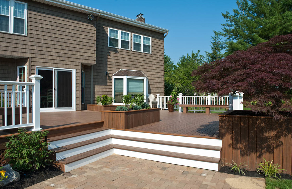 Inspiration for a large transitional backyard deck in New York with an outdoor kitchen and no cover.