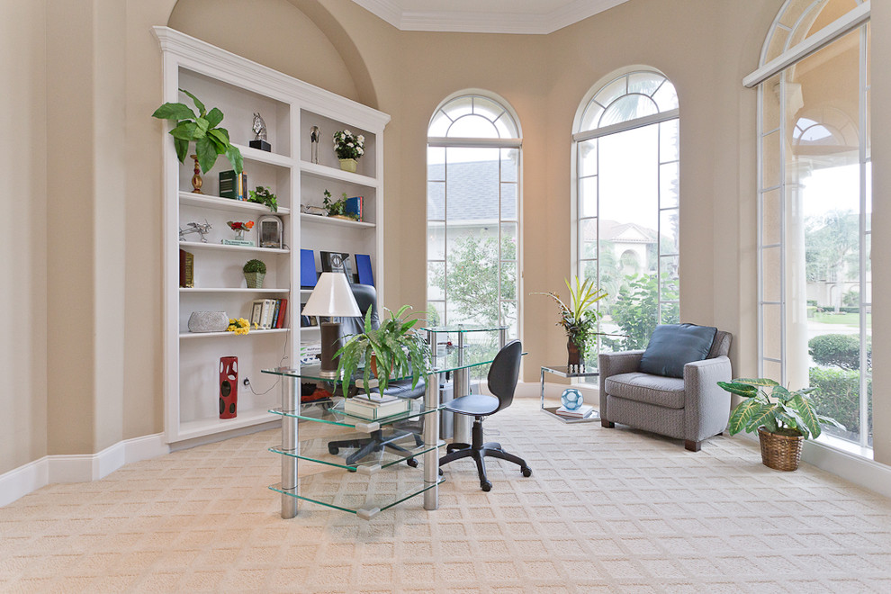 Inspiration for a contemporary home office in Houston with beige walls.