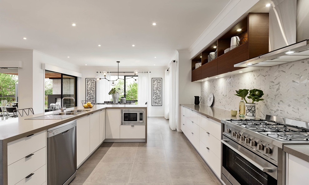 Photo of a contemporary u-shaped kitchen in Melbourne with a drop-in sink, flat-panel cabinets, white cabinets, grey splashback, stainless steel appliances and with island.