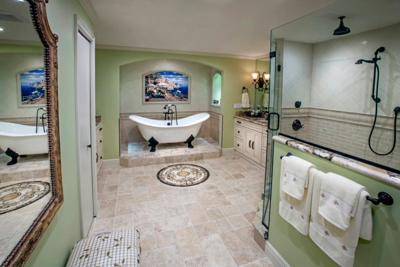 Design ideas for a large traditional master bathroom in Tampa with raised-panel cabinets, white cabinets, a claw-foot tub, a corner shower, beige tile, porcelain tile, green walls, travertine floors, an undermount sink, granite benchtops, beige floor and a hinged shower door.