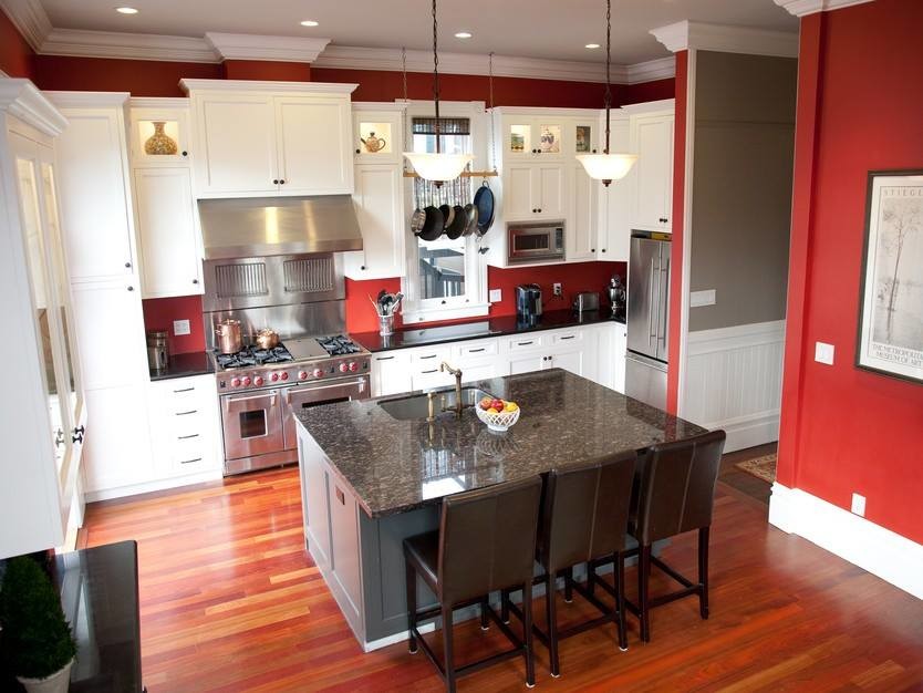Inspiration for a mid-sized transitional l-shaped dark wood floor eat-in kitchen remodel in Chicago with an undermount sink, shaker cabinets, white cabinets, granite countertops, stainless steel appliances and an island