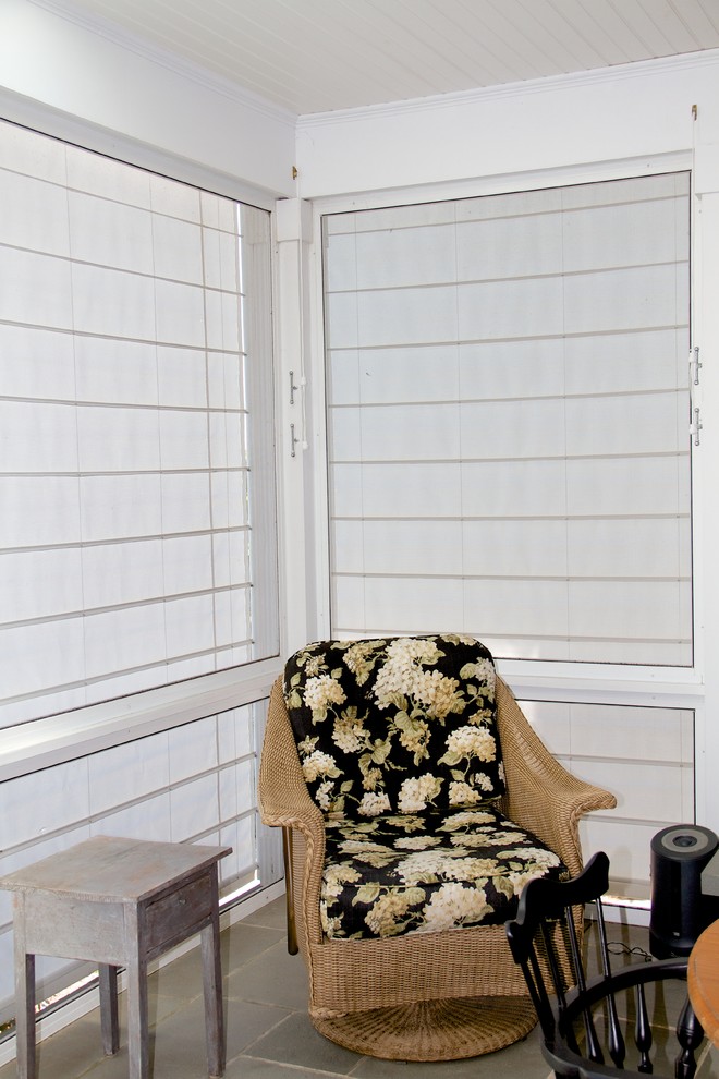 Screen porch shades keep the sun and wind out.
