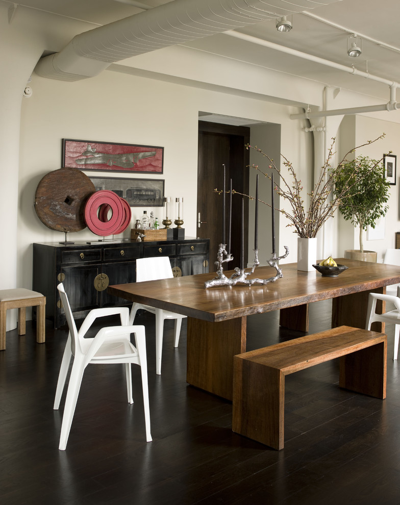 Inspiration for a contemporary dining room in New York with white walls and dark hardwood floors.