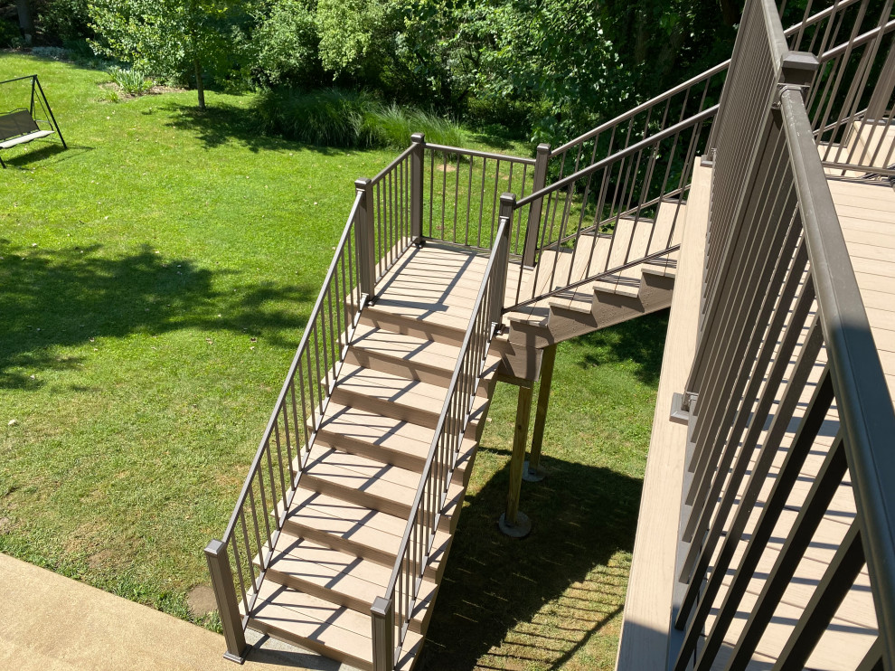 Inspiration for a large contemporary back first floor metal railing terrace in Cincinnati with no cover.
