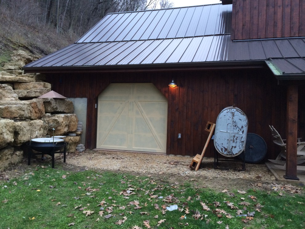 Inspiration for a mid-sized rustic brown two-story wood gable roof remodel with a metal roof