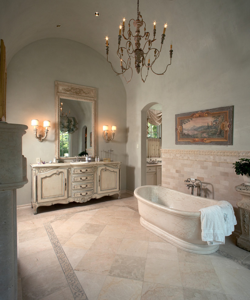 Inspiration for a mediterranean bathroom in Houston with a freestanding tub.