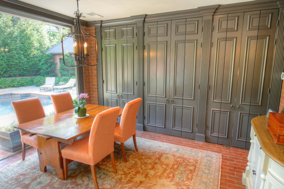 Open concept kitchen - mid-sized transitional l-shaped brick floor open concept kitchen idea in Charlotte with an undermount sink, shaker cabinets, white cabinets, marble countertops, beige backsplash, subway tile backsplash, stainless steel appliances and an island