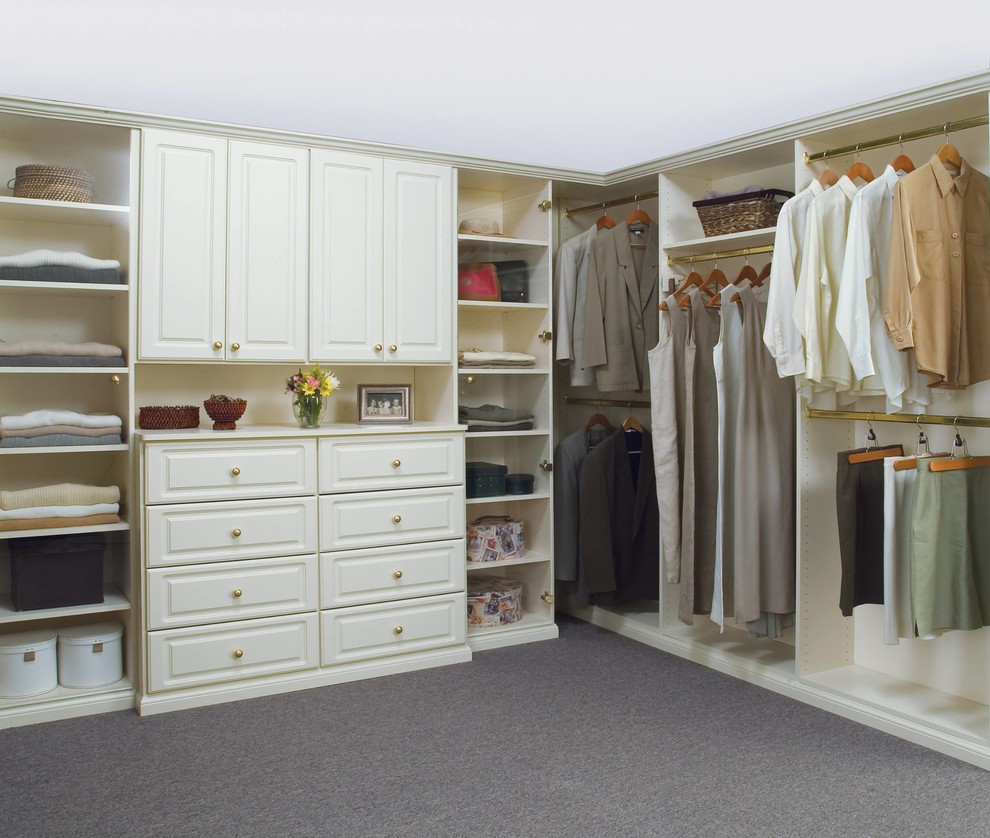 Photo of a large transitional gender-neutral walk-in wardrobe in Louisville with raised-panel cabinets, white cabinets, carpet and grey floor.