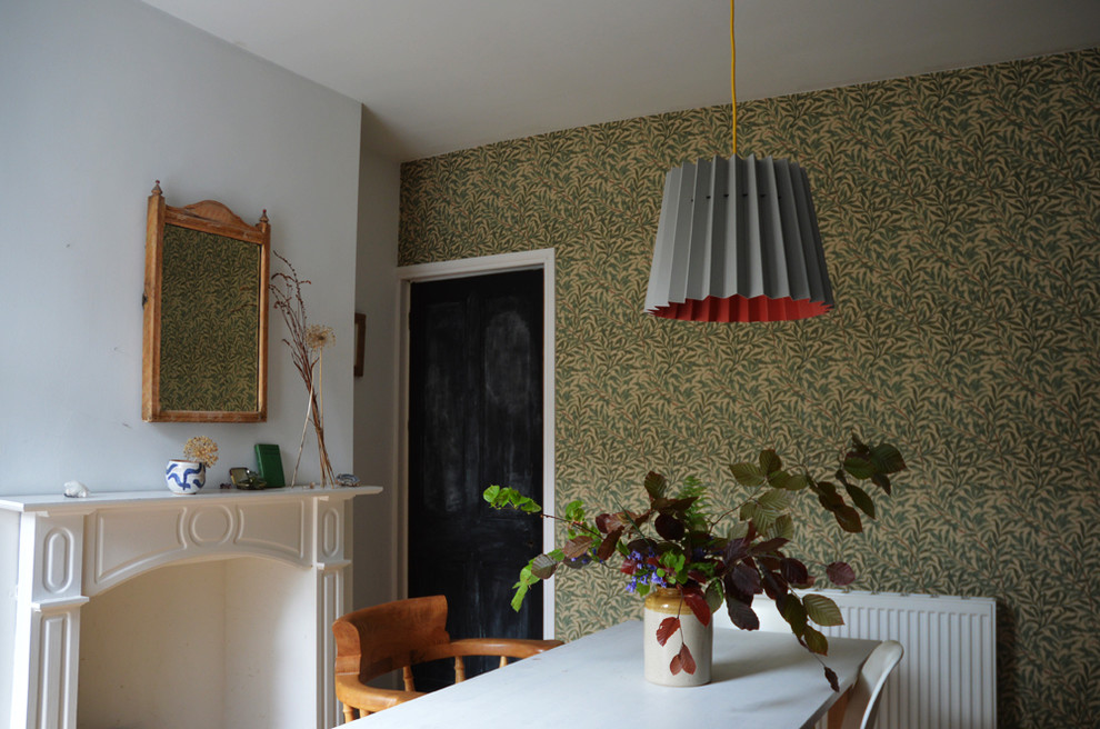 Inspiration for a mid-sized midcentury dining room in Other with green walls.