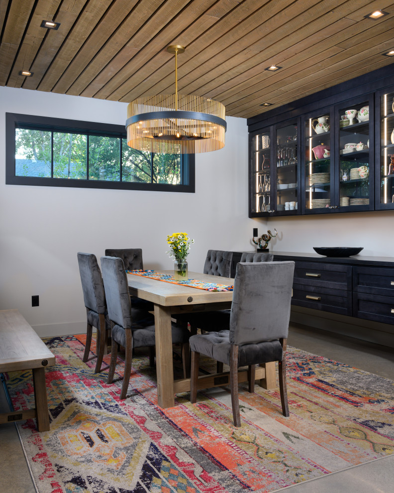 Inspiration for an industrial separate dining room in Other with grey walls.