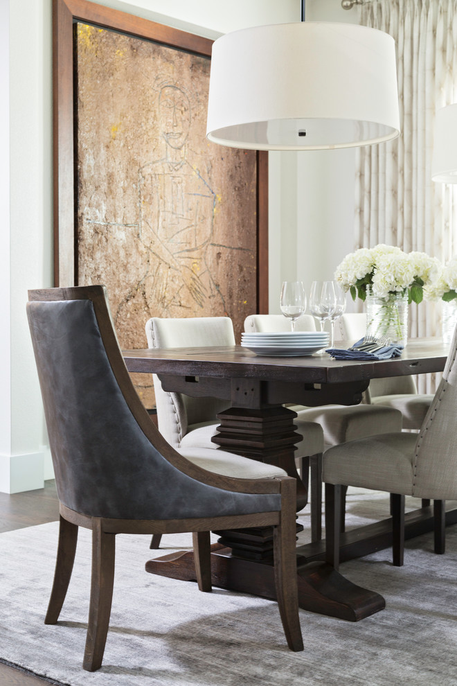 Example of a mid-sized transitional enclosed dining room design in Orlando with white walls and no fireplace
