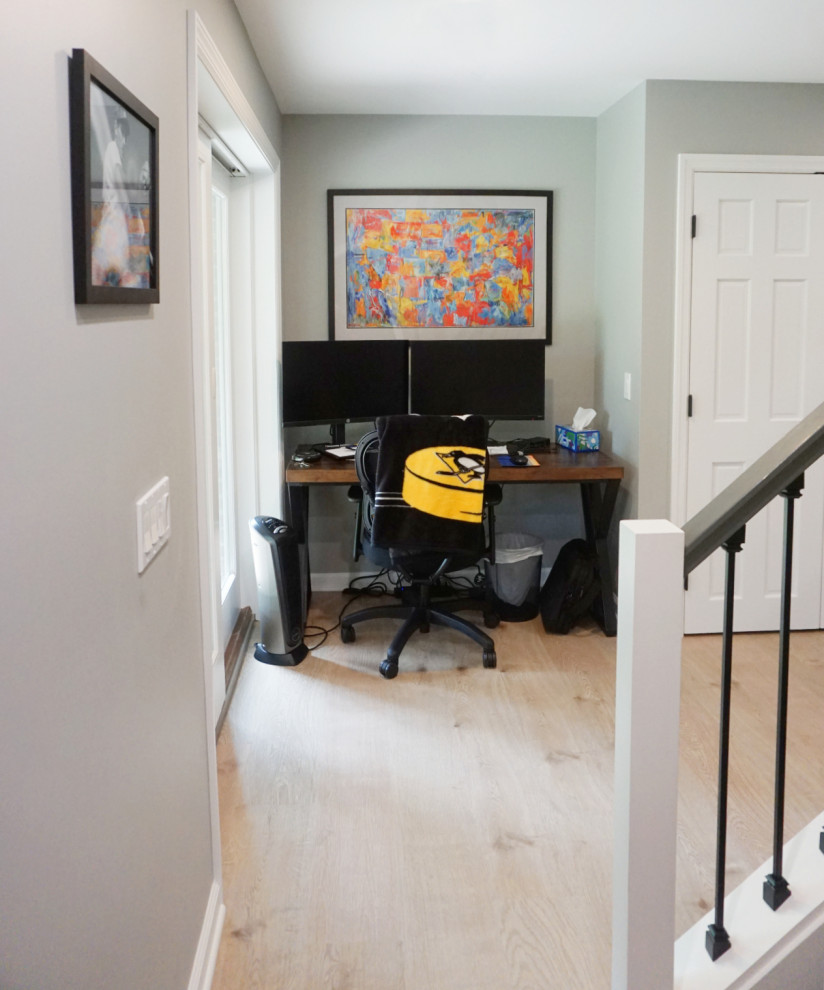 Inspiration for a transitional vinyl floor basement remodel