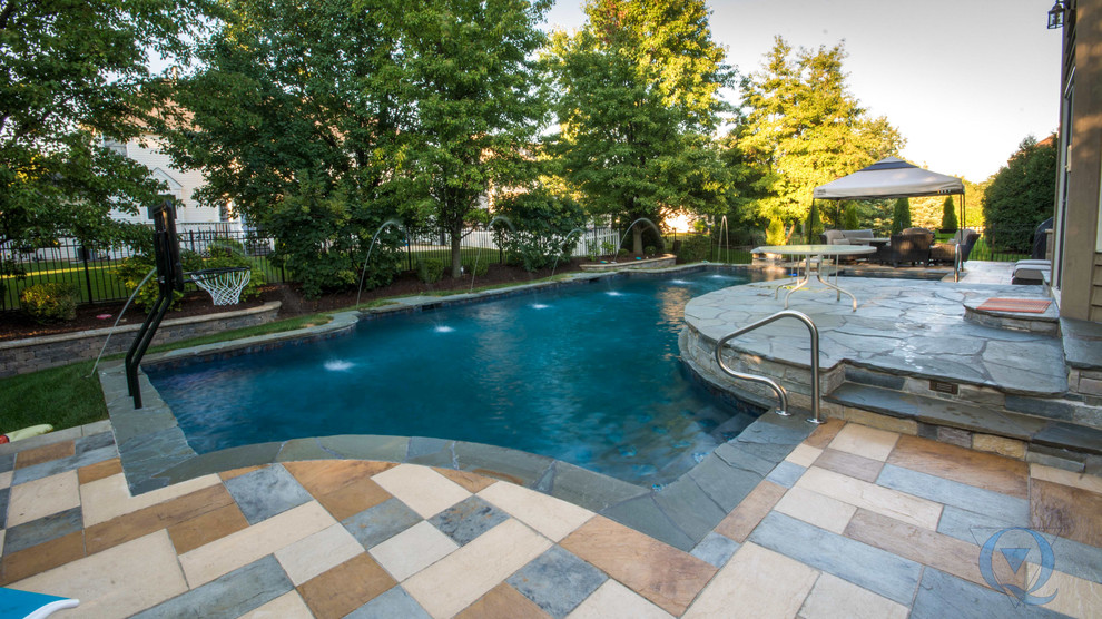 Mid-sized mountain style backyard stone and custom-shaped lap pool photo in Chicago