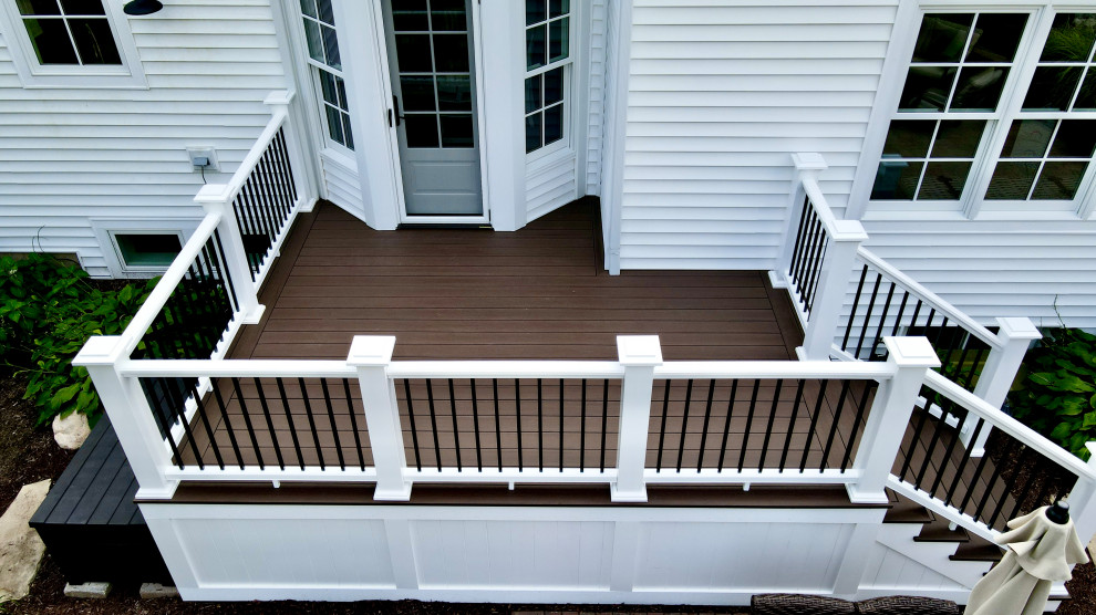 Photo of a small transitional backyard deck in Chicago with mixed railing.