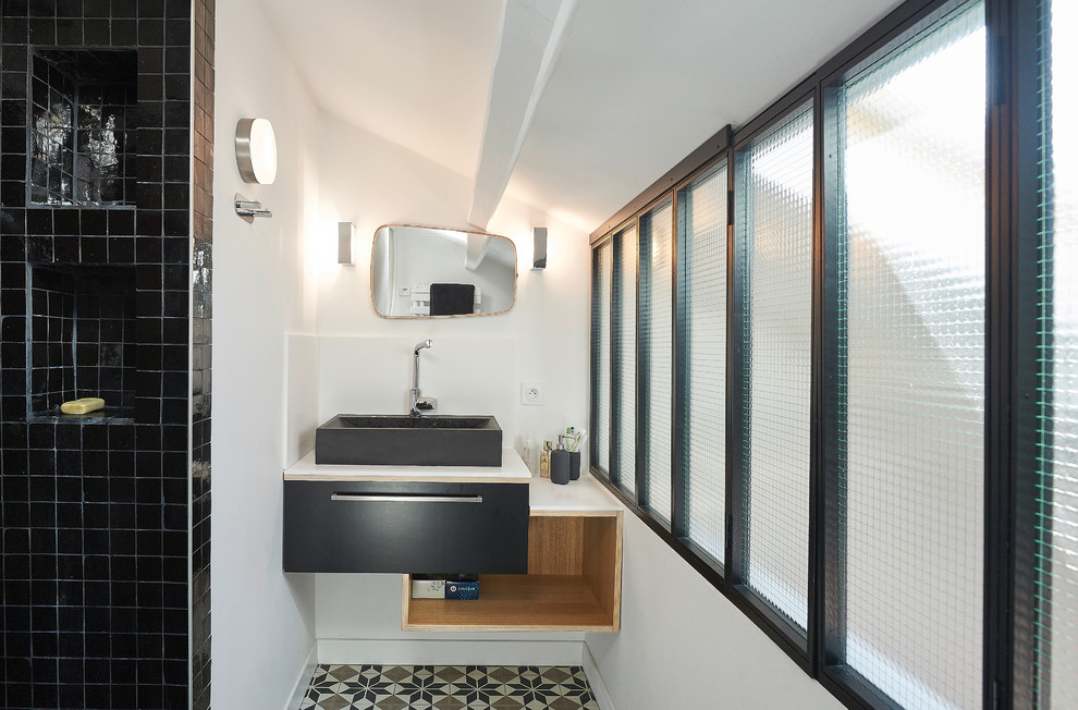 Inspiration for a small contemporary 3/4 bathroom in Paris with black cabinets, an alcove shower, white walls, ceramic floors and a vessel sink.
