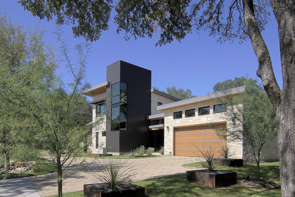 This is an example of a modern exterior in Austin with stone veneer.