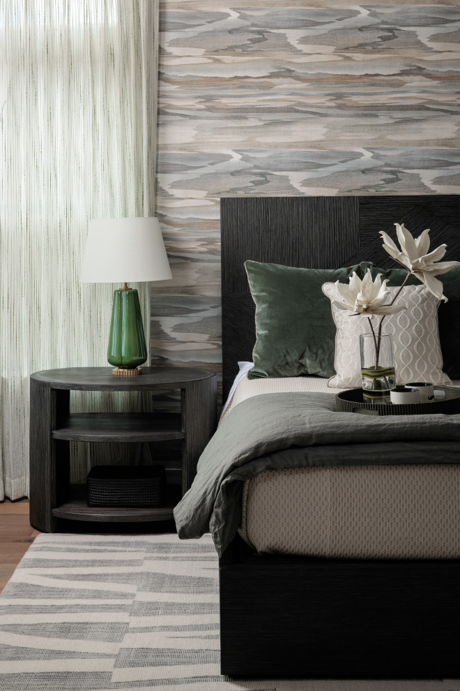 Inspiration for a large transitional master medium tone wood floor, brown floor and wallpaper bedroom remodel with multicolored walls
