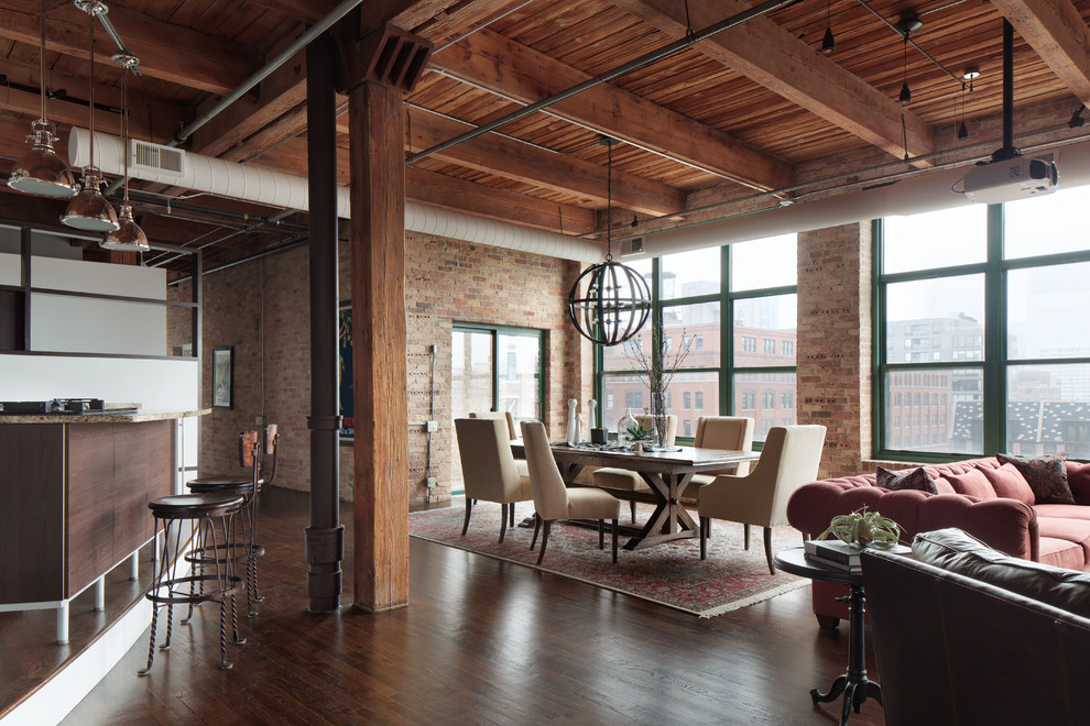 Industrial open plan dining in Denver with dark hardwood floors and brown floor.