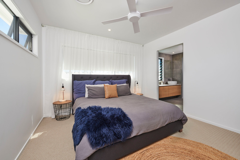 Inspiration for a contemporary guest bedroom in Brisbane with white walls, concrete floors and beige floor.