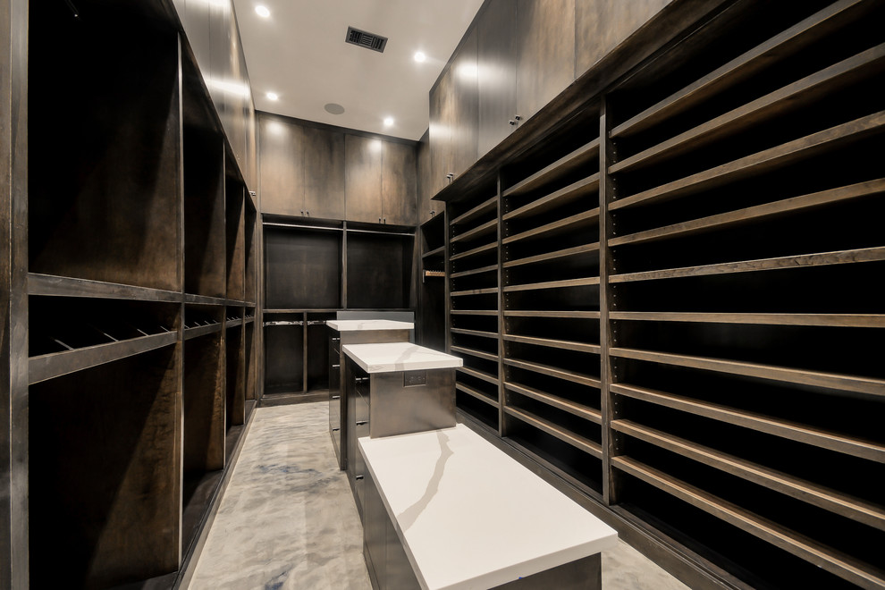 Design ideas for a large contemporary men's dressing room in Houston with open cabinets, dark wood cabinets and porcelain floors.