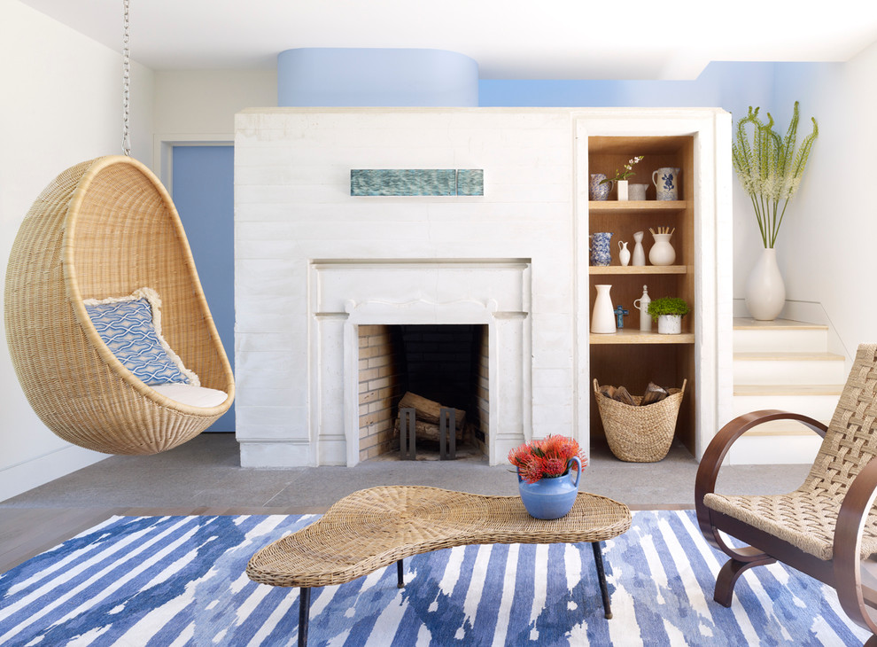 Contemporary open concept family room in New York with a standard fireplace, no tv and multi-coloured walls.