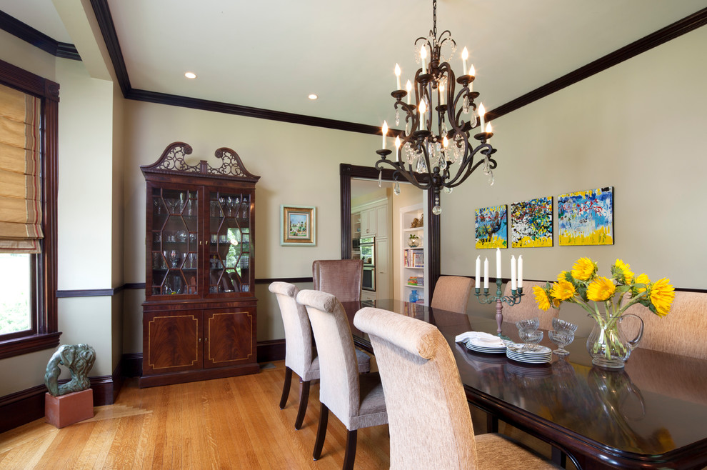 Photo of a traditional dining room in Boston with beige walls and medium hardwood floors.