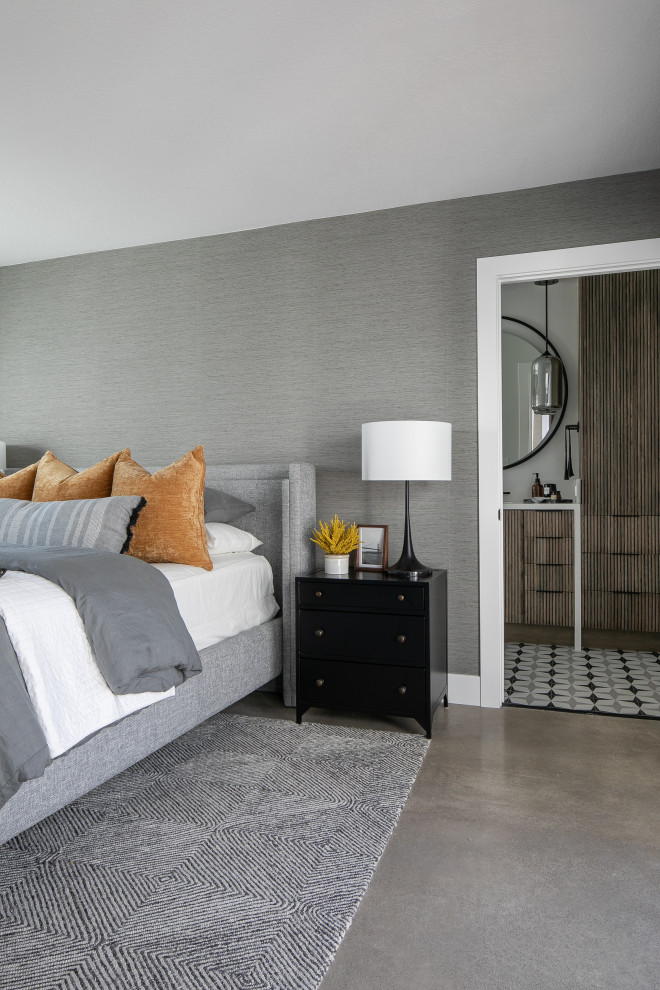 This is an example of a mid-sized midcentury master bedroom in Orange County with grey walls, concrete floors, grey floor and wallpaper.