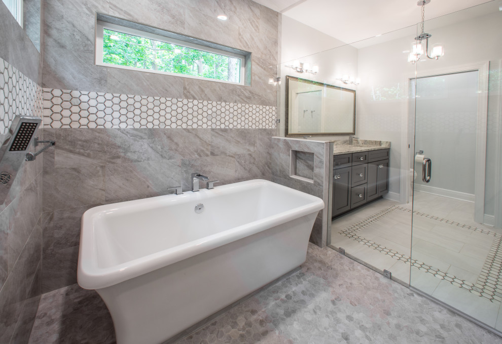 Inspiration for a mid-sized timeless master multicolored tile and porcelain tile porcelain tile, white floor and double-sink freestanding bathtub remodel with recessed-panel cabinets, gray cabinets, a one-piece toilet, white walls, an integrated sink, quartzite countertops, a hinged shower door, multicolored countertops and a built-in vanity