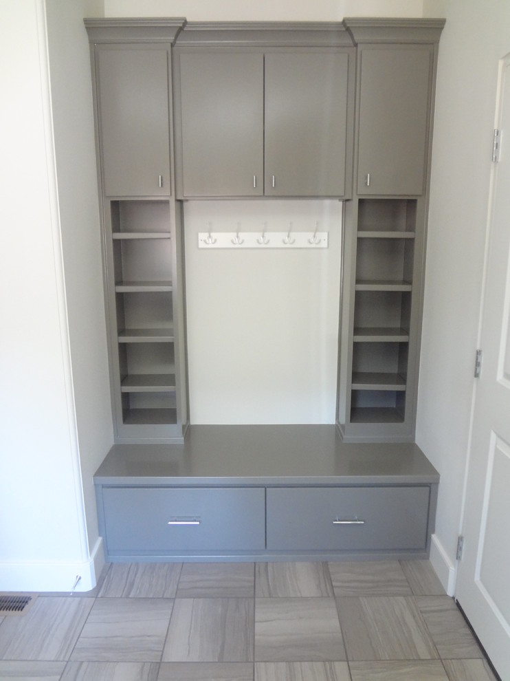 Photo of a mid-sized contemporary l-shaped dedicated laundry room in Portland with an undermount sink, flat-panel cabinets, grey cabinets, quartzite benchtops, white walls, ceramic floors and a side-by-side washer and dryer.