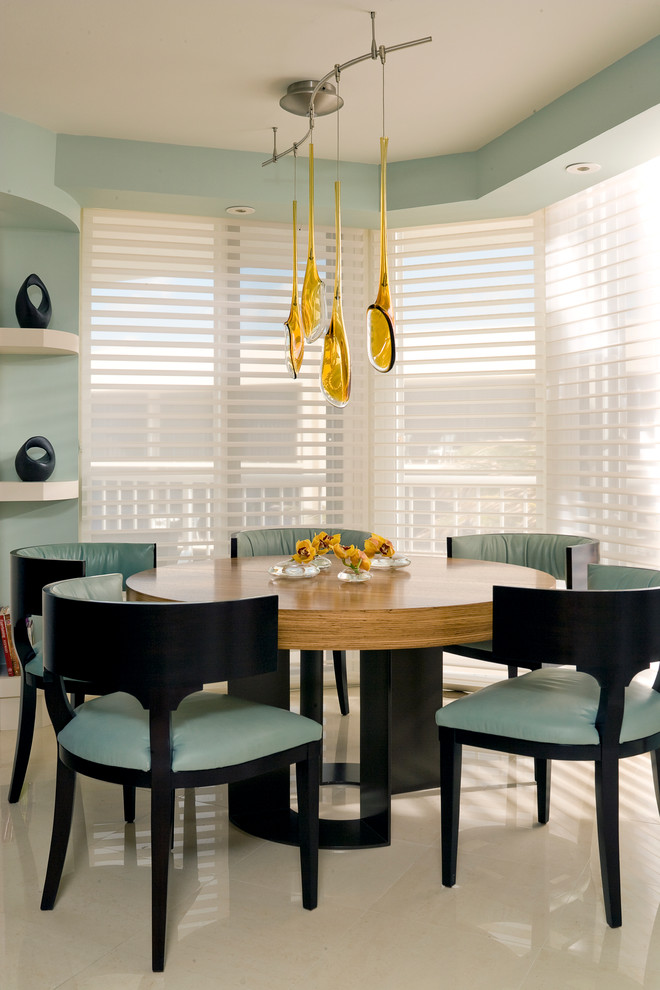 Photo of a contemporary dining room in Miami with blue walls.