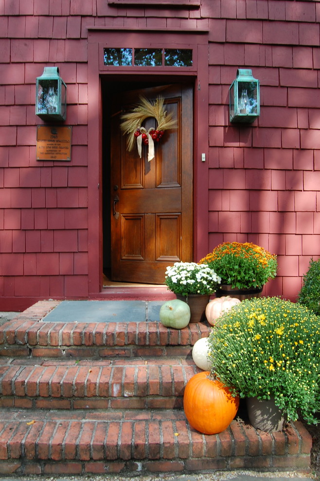 Entryway - farmhouse entryway idea in New York with a medium wood front door