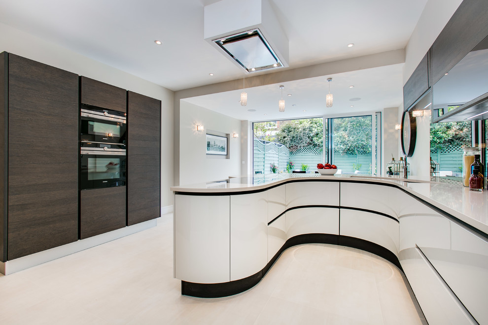 Contemporary u-shaped kitchen in Oxfordshire with an undermount sink, flat-panel cabinets, white cabinets, mirror splashback, white floor and white benchtop.