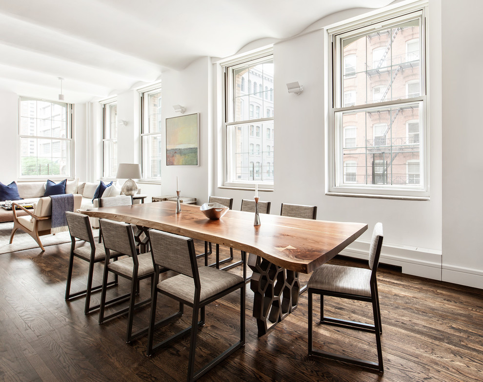 Inspiration for a transitional open plan dining in New York with white walls and dark hardwood floors.