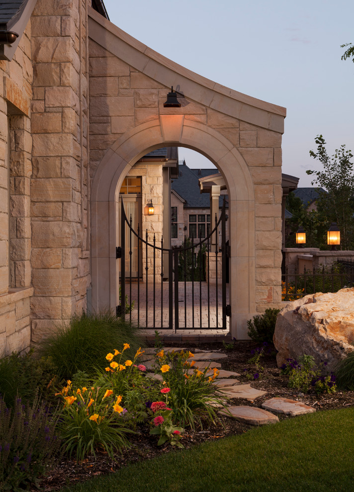 Traditional courtyard garden in Salt Lake City with natural stone pavers.
