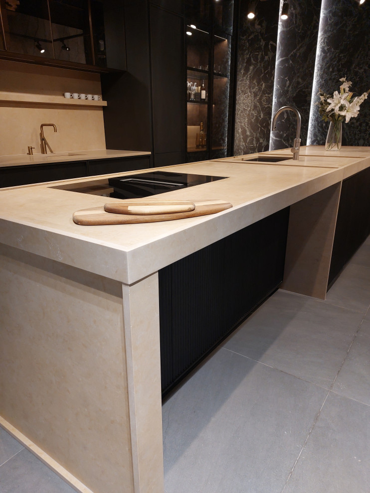 Large traditional kitchen/diner in Hertfordshire with an integrated sink, beaded cabinets, dark wood cabinets, limestone worktops, beige splashback, limestone splashback, coloured appliances, porcelain flooring, an island, grey floors, beige worktops and a coffered ceiling.