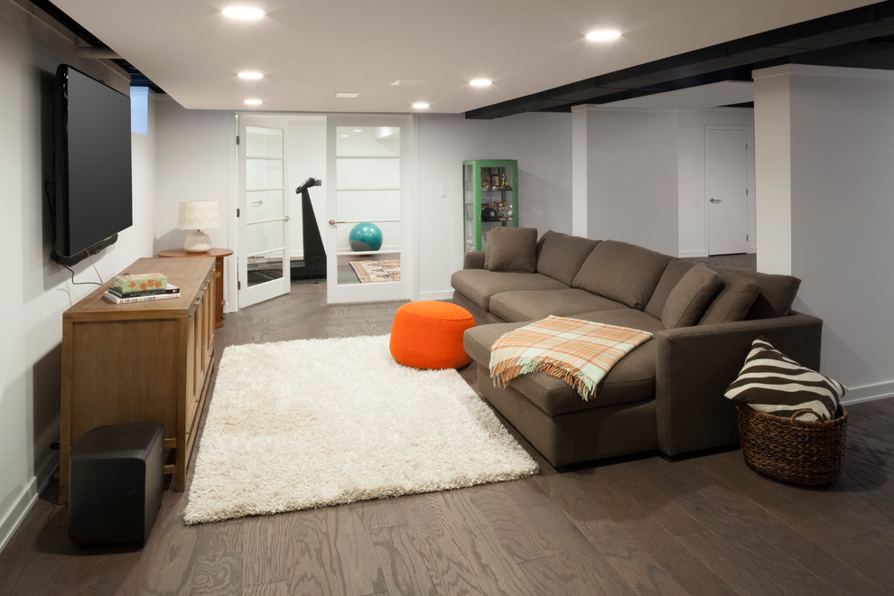 This is an example of a mid-sized contemporary walk-out basement in New York with white walls, no fireplace, porcelain floors and brown floor.