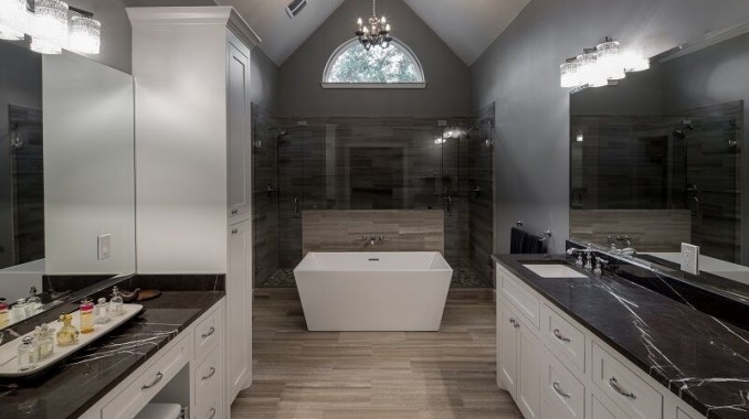 Inspiration for a large contemporary master bathroom in Dallas with shaker cabinets, white cabinets, a freestanding tub, an alcove shower, a two-piece toilet, black tile, gray tile, porcelain tile, grey walls, porcelain floors, an undermount sink, soapstone benchtops, brown floor and a hinged shower door.
