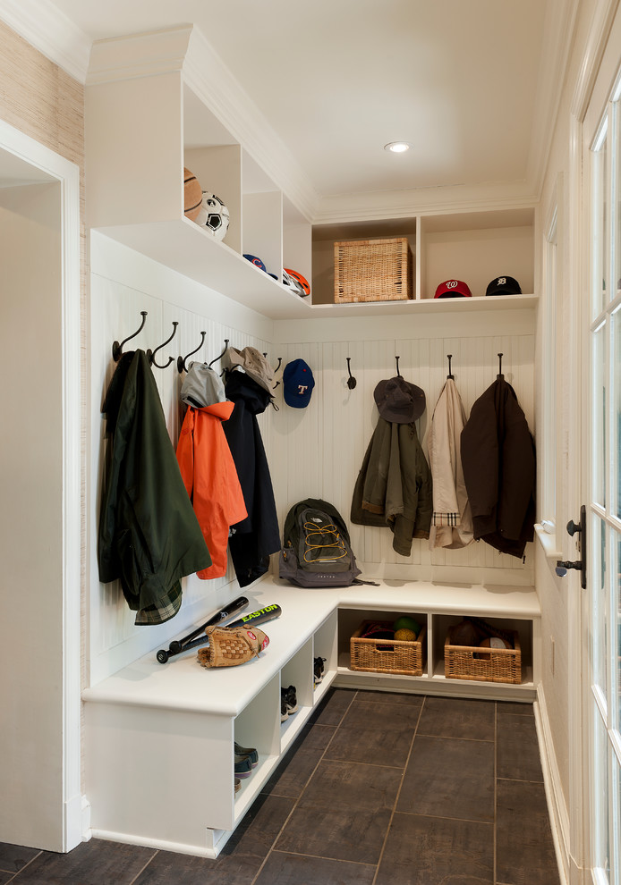 Photo of a traditional mudroom in DC Metro with grey floor, white walls and porcelain floors.