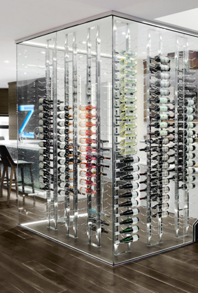Inspiration for a large modern wine cellar in Calgary with dark hardwood floors and display racks.